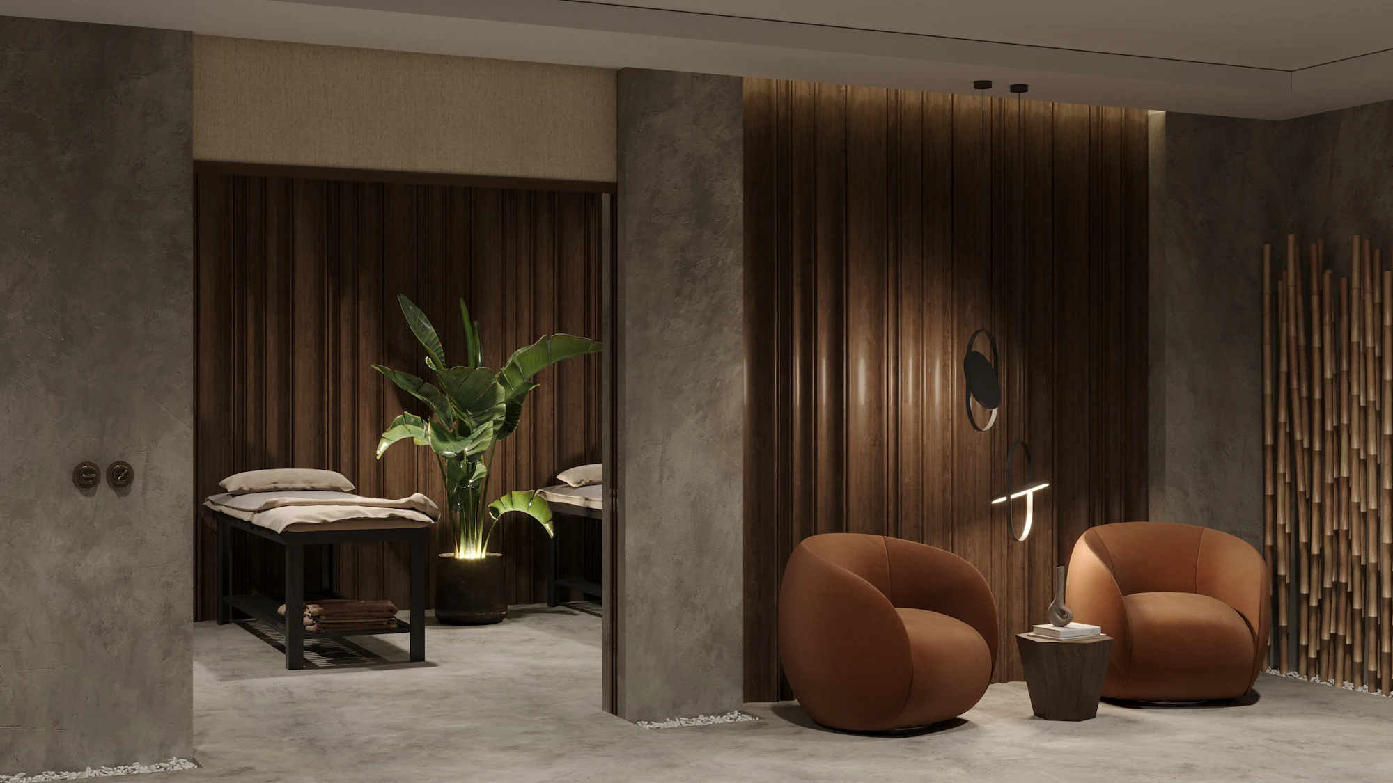 A calm treatment suite with warm wood walls, two treatment beds and a pair of rust velvet lounge chairs